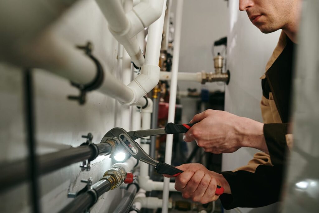 Plumbers maintaining commercial plumbing pipes in Sun City Center